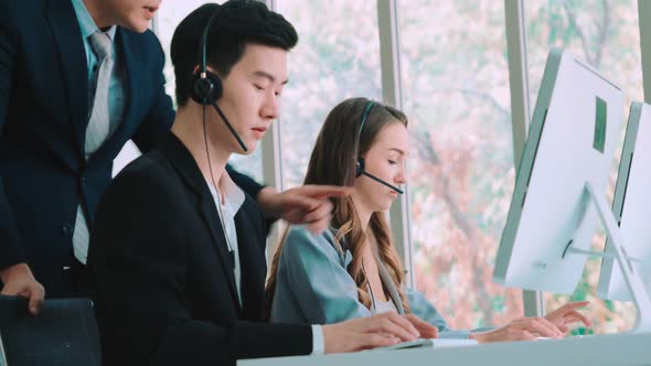 Business People Wearing Headset Working in Office