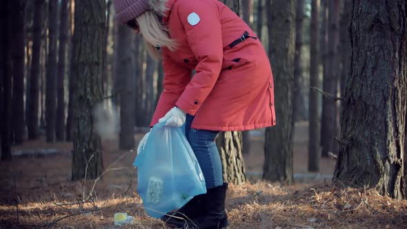 Picking Tidying Trash Recycling. Cleaner Woman Collecting Trash In Forest.