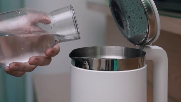 Closeup of Filling the Kettle with Water
