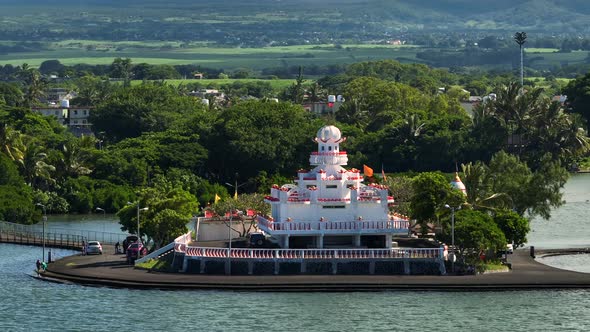 Aerial View of an Indian Temple in the Indian Ocean Lagoon Amidst Lush Green Vegetation Against the