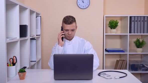 Smiling Man Has Phone Conversation on Mobile