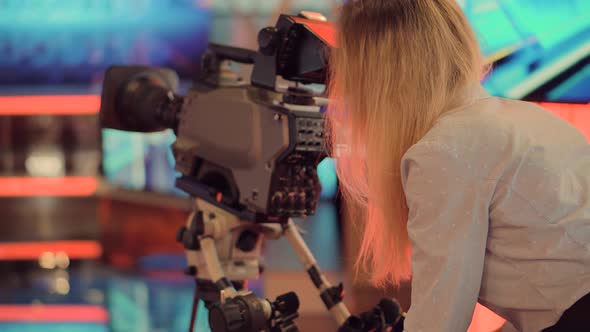 Woman Tv Camera Operator.Girl Working On Tv Studio Broadcasting Tv Channel.Making TV Show Or Film.