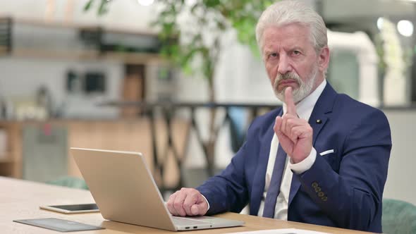 Senior Old Businessman with Laptop Showing No Sign with Finger 
