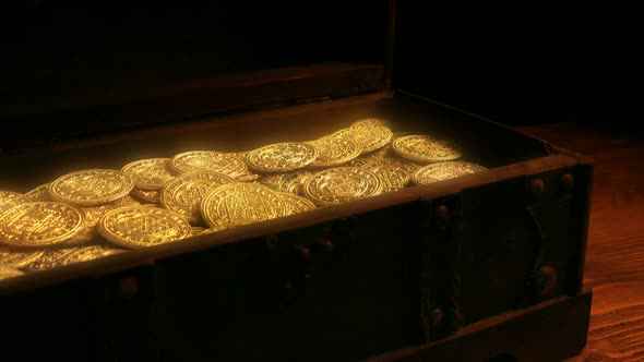 Chest Opens In Firelight With Glowing Gold Coins
