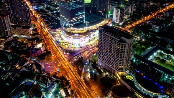 Bangkok business district city center above intersection, during night – Time Lapse