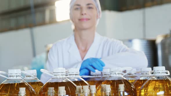 Portrait of confident female technician standing with arms crossed 4k