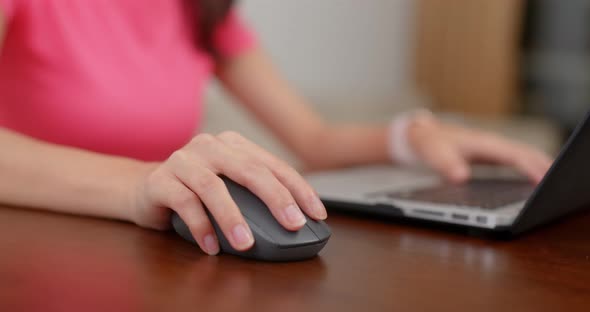 Woman type on the laptop computer