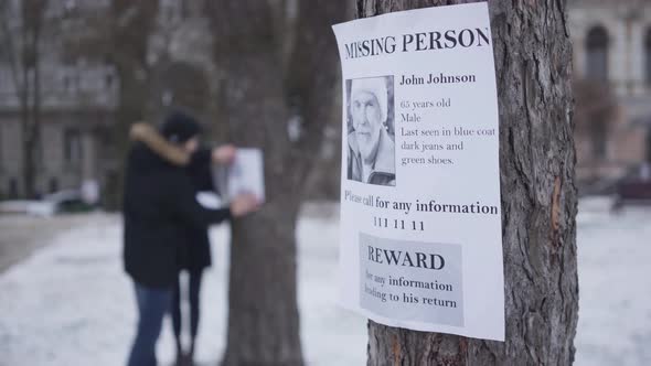 Close-up of Missing Person Ad with Information About Lost Senior Caucasian Man