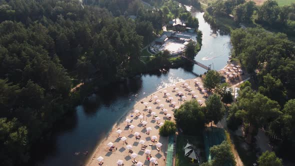 Aerial Top View of River Sand Beach with Lounges and Umbrellas