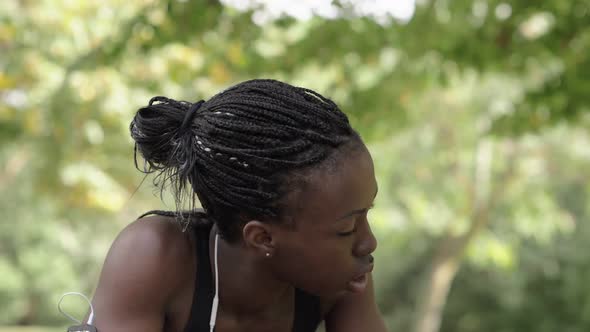 Sport, training, concentration.young black female athlete catches her breath