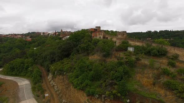 Drone Flying Above Old Sighnaghi Town in Georgia, View of Stone Wall and Houses