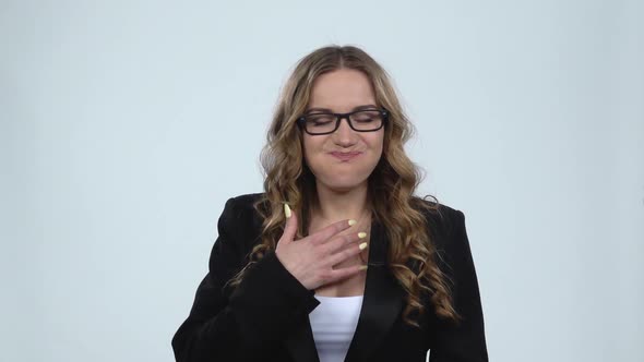 Woman Eagerly Eating Sweet White Marshmallow, Isolated on a Gray Background, Slow Motion.