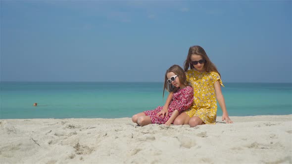 Little Girls Having Fun Enjoying Vacation on Tropical Beach