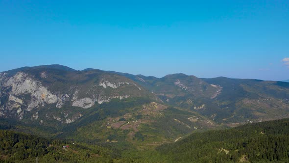 steep green mountains, deep forest and mountain road, beautiful valley  