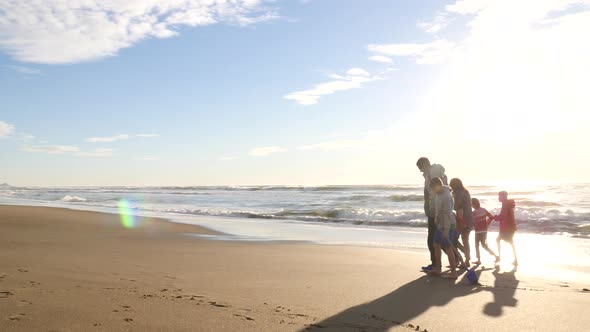 Family walking on beach