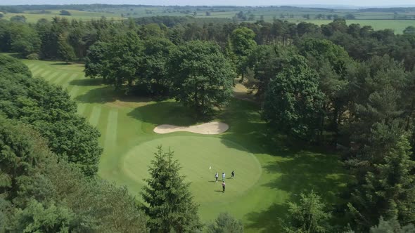 Golfers on the Green of a Golf Course Aerial View