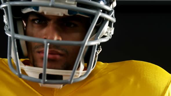 American football player with a head gear 4k