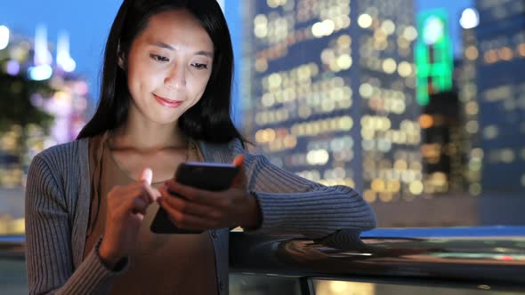 Woman Using Smart Phone at Night 