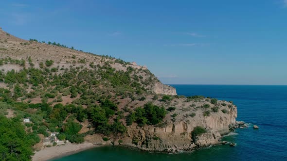 Sea nature and high rocky hills on the shore