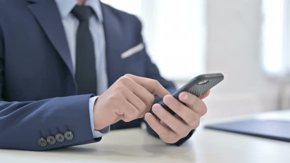 Hands of Businessman Using Smartphone