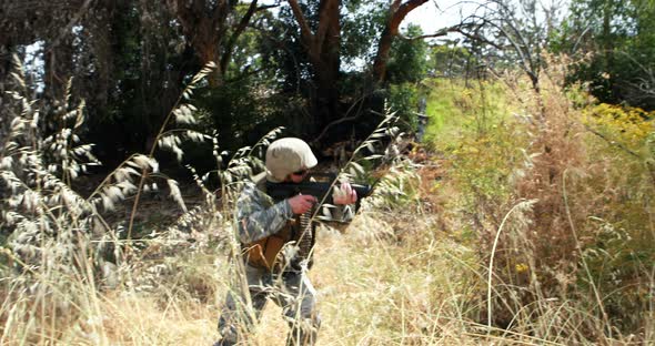 Military soldier guarding with a rifle