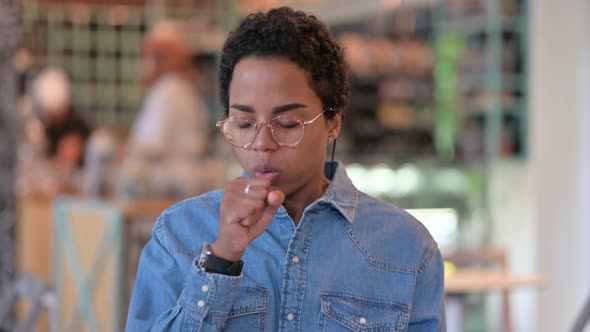 Portrait of Sick Young African Woman Coughing