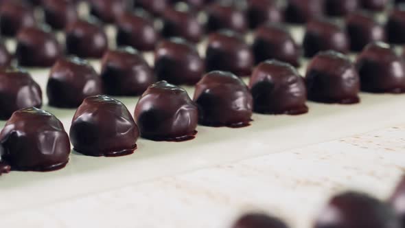 Chocolate Sweets Are Getting Transported in Rows