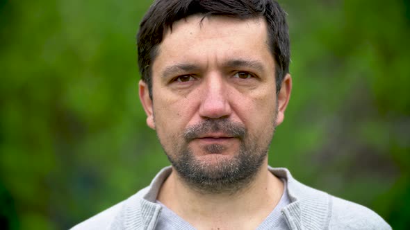 Closeup portrait of an adult man with a beard