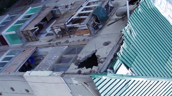Vertical Video of the Consequences of the War in Ukraine  a Destroyed Residential Building