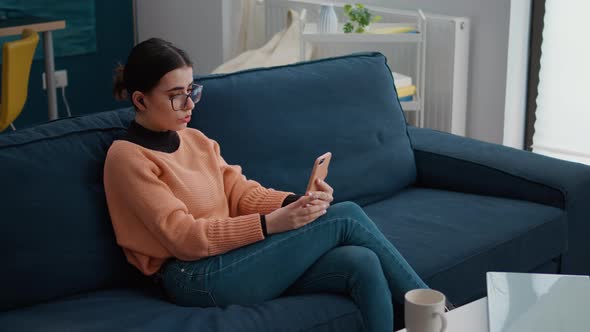 Young Adult Using Smartphone to Chat on Remote Video Call