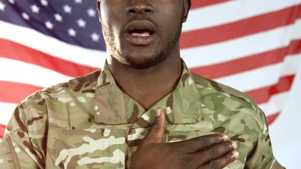 Portrait of military soldier singing a national anthem