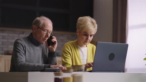 Old Man and Woman are Shopping Online Doing Order in Internet Shop Calling to Callcenter for