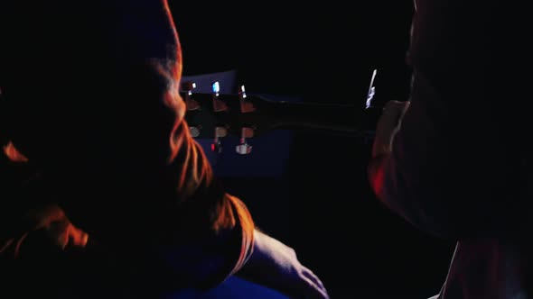 Two Men Recording a Song in the Studio - Playing Guitar