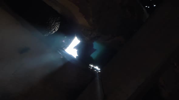 Rays of Sun Shine in Sewarage Manhole Through Access Port