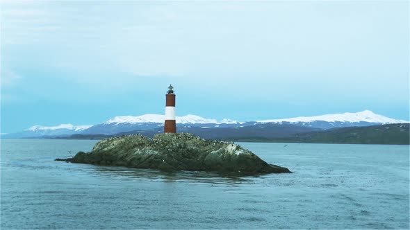 Red and white Lighthouse in the Beagle Channel, South America.