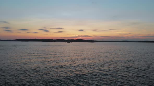 Descending aerial shot of a boat on lake travis at sunset. Shot in Austin Texas 9/10/20