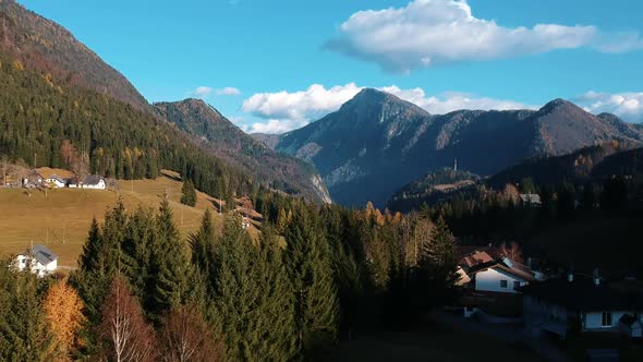 Magnifficent Drone Shot of Mountains with Green Woods