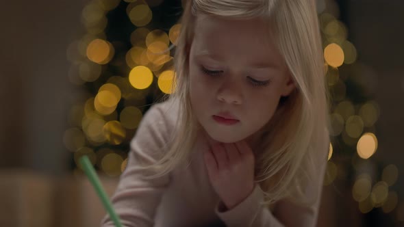 Little Girl Of Four Years With Blond Long Hair