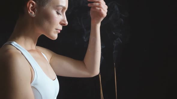 Yoga Woman in White Sport Clothes Sit on Mat and Meditate, Breathes