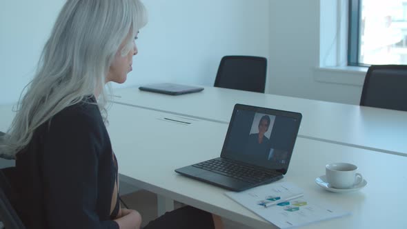 Female Colleagues Using Laptop for Video Call