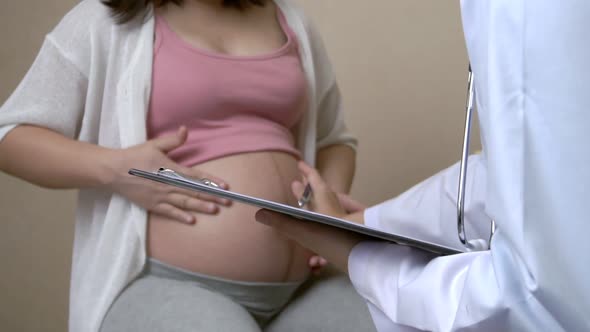 Pregnant Woman and Gynecologist Doctor at Hospital