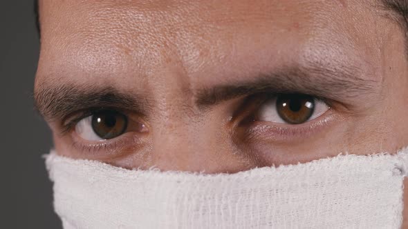 Portrait of Young Man in Protective Gauze Mask, Protection Coronavirus COVID-19