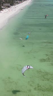 Vertical Video Kitesurfing Near the Shore of Zanzibar Tanzania