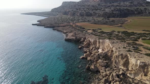 Mediterranean Sea. Flight of the camera over the mountains and the sea. Steep rocky cliff. Cyprus