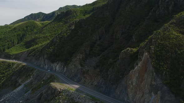 Mountains valley of Altai with traffic cars on Chuya highway