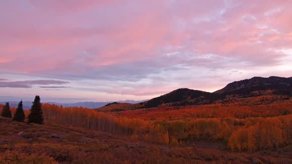 Time lapse of colorful sunset over Fall color mountain landscape