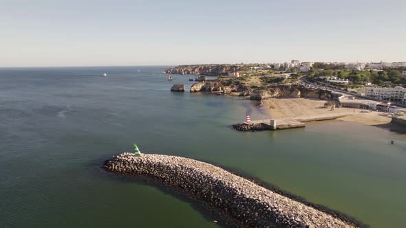 Bensafrim River mouth, Lagos, Algarve. Panoramic view of the Atlantic coast and city.