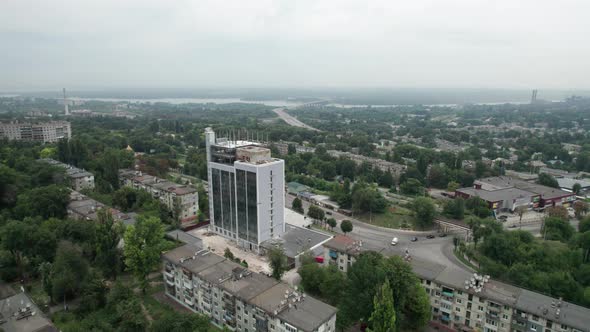 Aerial View of a Small Town Urban Landscape Flying By Houses Near Green Spaces