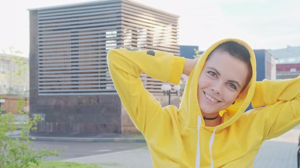  Portrait of Young Woman with Shaved Hair in Street Urban Background