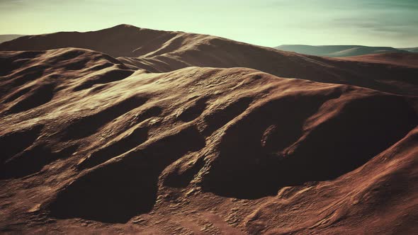 Aerial View of Red Desert with Sand Dune